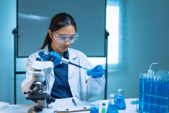 A laboratory professional working with samples and a pipette